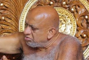 Bald, elderly man with a gray beard sits shirtless on an ornate carved wooden throne with gold circular patterns.